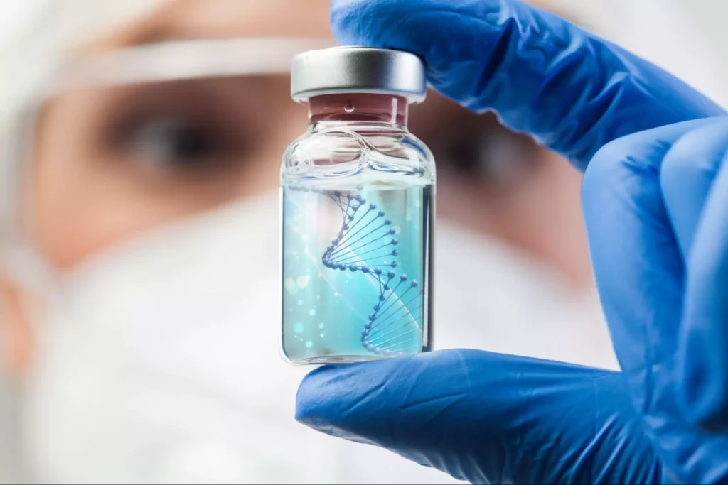 A lab scientist holding a vial